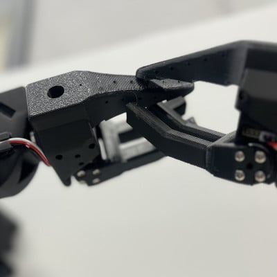 Two robotic grippers meeting in Ruth Martinez-Yepez's Handshakes